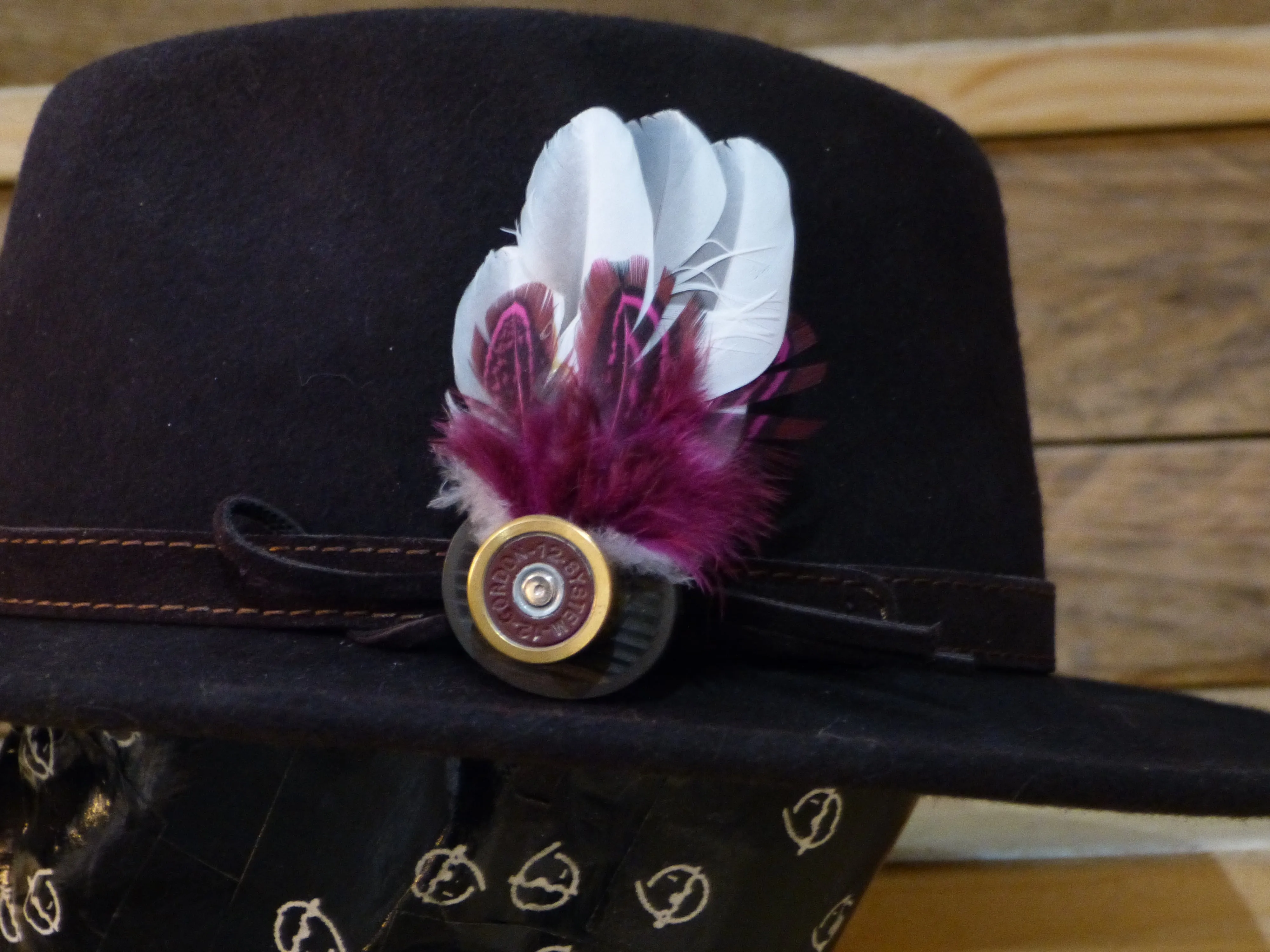 Feather Brooch or Hat Pin set in cartridge case head.