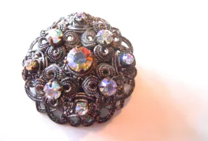 Iridescent Rhinestone Filigree Domed Brooch circa 1960s