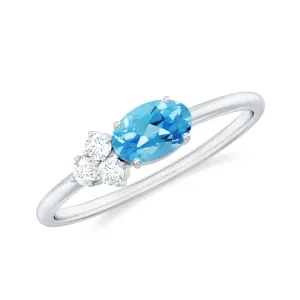 Oval Cut Swiss Blue Topaz Promise Ring with Diamond Trio