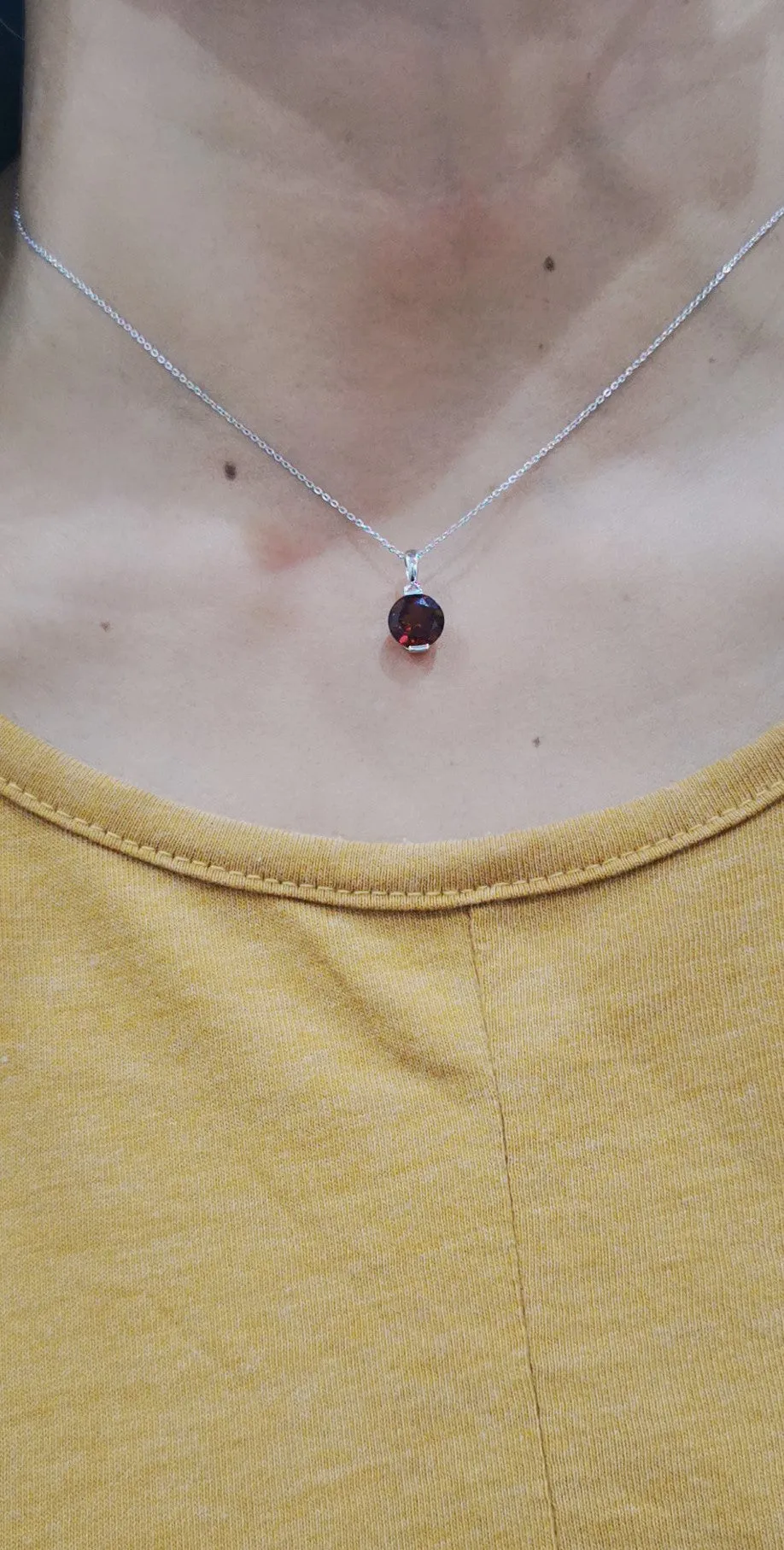 Solitaire Garnet Pendant In 18k White Gold.