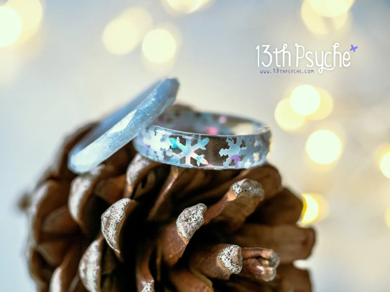 Winter inspired snowflake and white glitter resin ring set of two