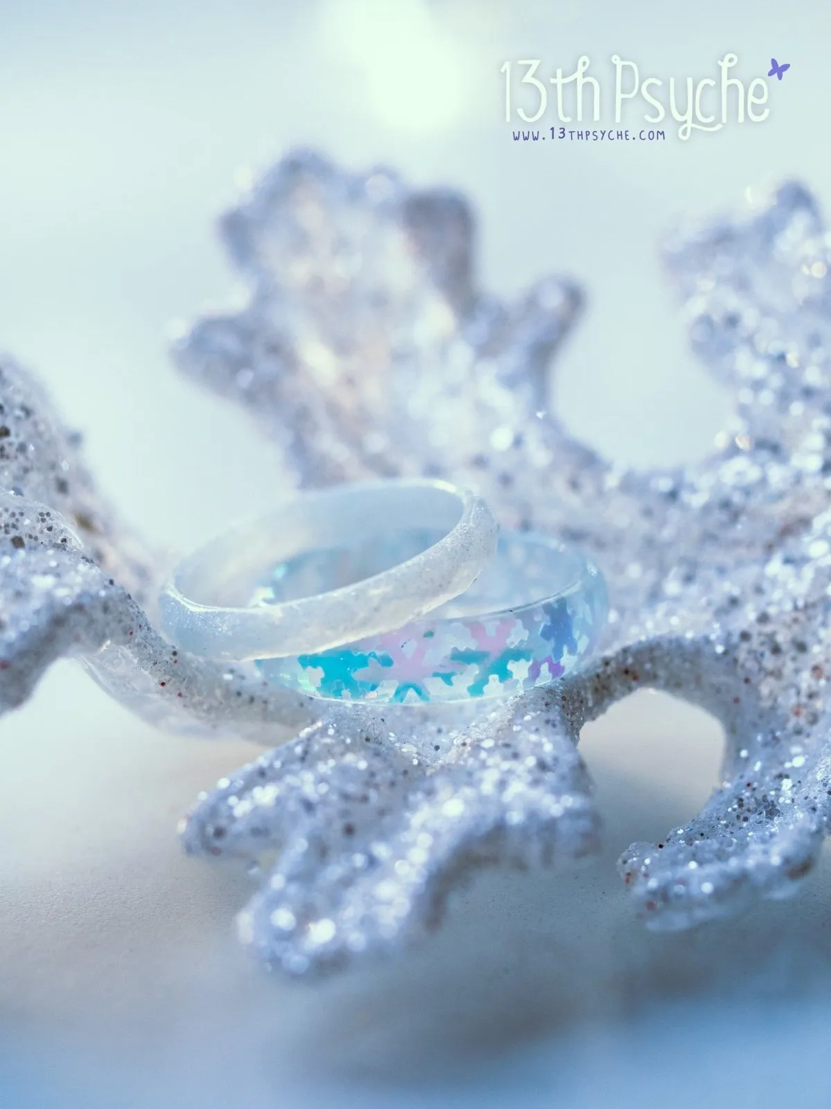 Winter inspired snowflake and white glitter resin ring set of two